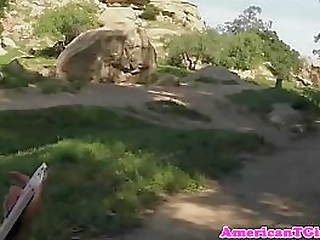 redhead ladyboy teasing and playing outdoors