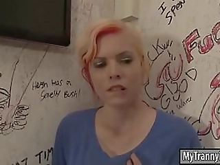 babe sucks tranny'_s cock thru gloryhole