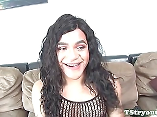 darkhaired busty shemale masturbates after stripping