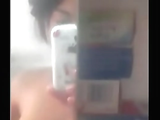 brunette asian shemale in red dress jerks off and cums on her belly