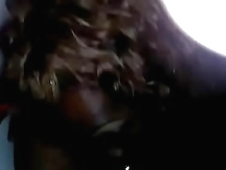 fierce lingeried shemale stroking her shecock on her chair